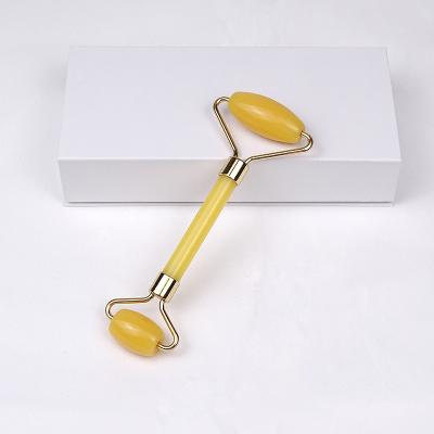 China Massager Anti Aging Tool Face Lift Anti Wrinkle Neck Contour Gua Sha Yellow Stone Facial Roller for sale