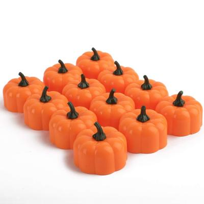 China Morden 12pcs LED Flickering LED Flameless Candles Thanksgiving Tea Light Battery Operated Realistic Pumpkin 3D Candles Halloween for sale