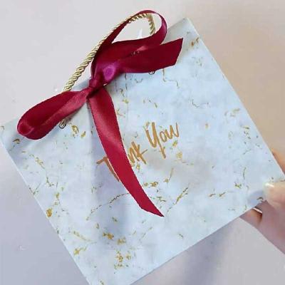 China Biodegradable High Quality Custom Logo Printed Paper Bags Package Laminated Wholesale Custom Marble Gift Bags for sale