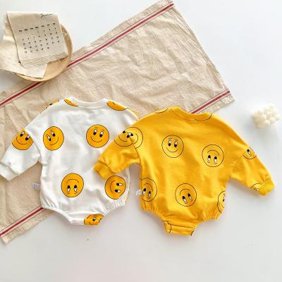 China Comfotable Spring Autumn Korean Infant Cartoon Smiling Face Loose Cotton Organic Girl Clothes Printed Baby Boy Jumpsuit Rompers for sale