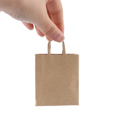 China 1:12 Toy Creative New Cartoon Dollhouse Mini Kraft Paper Bag Handbag Miniature Doll Shopping Bag Decor Children Play Gift for sale