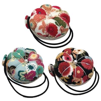 China Wrist Strap Pincushion Sewing Mat DIY Sewing Craft Supplies Pins Accessories Pumpkin Pin Cushion Sewing Ball Shaped Needle for sale