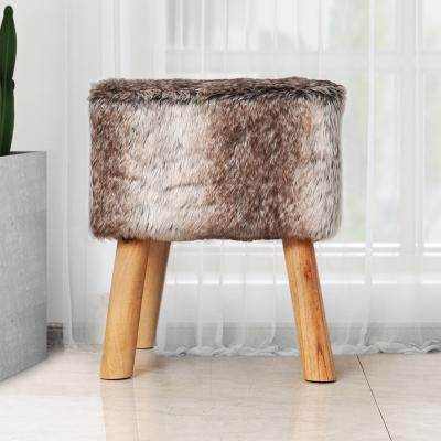 China 2021 Modern European Seated Living Room Furniture Style Kids Faux Fur Ottoman Stool With Wooden Legs for sale