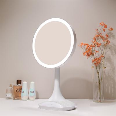 China Customized Electric Rotate 360 ​​Degree Smart Round Touch Table Stand Portable Makeup Stand Up Desk Led Vanity Mirror With Lights for sale