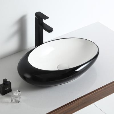 China Modern Unique Style White and Black Bathroom Art Countertop Ceramic Sink for sale