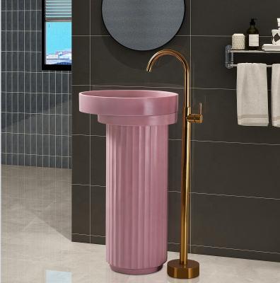 China Solid Cylinder Pedestal Sink Modern Design Pedestal Sink Modern Pink Colored Nano Stone One Piece Sink for sale