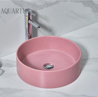 China Populared Modern Style Modern Bathroom Sink Pink Color Resin Artificial Hand Basin for sale