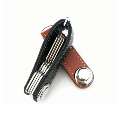 China Folding Leather Pocket Toy Seal Compact Key Holder PU Key Chain Smart Key Holder for sale