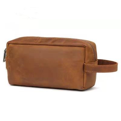 China Hot Selling Vintage Travel Makeup Bag Unisex Crazy Horse Logo Multifunctional Bag Women Genuine Leather Cosmetic Clutch Bag for sale