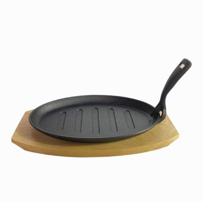 China Sustainable Kitchen Wholesale Cooking Care Set With Wooden Tray Base Cookware Sets Fry Grill Pan Cast Iron Sizzling Fajita Steak Dish Pans for sale