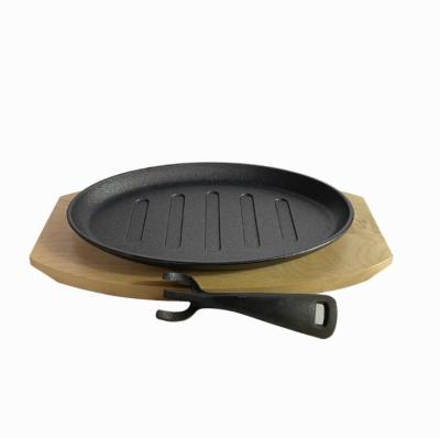 China Sustainable Factory Sale Cast Iron Fajita Casserole Sizzling Dish With Wooden Base for sale