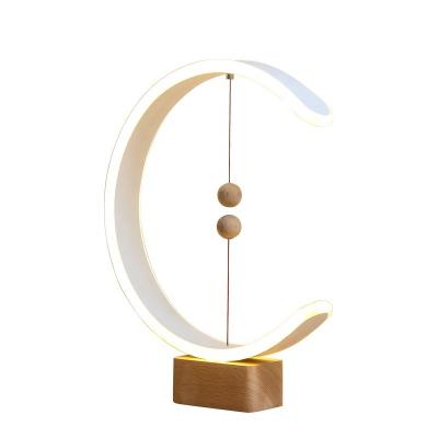 China Modern Magnetic Levitating Faux Balls Table Lamp Wooden Base For Bedroom Holiday New Year Christmas Gift Reception Hideaway Decors for sale