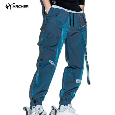 China Custom Reflective Nylon Mens Sports Tracksuit Pockets Anti-Wrinkle Work Laser Pants Trousers Track Cargo Pants for sale