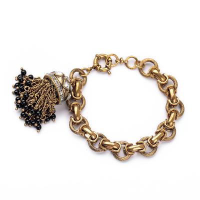 China Unique Vintage Jewelry Designer Accessories Antique Gold Chunky Tassel Charm Metal Hand Chain Link Bracelet with Handmade Tassel for sale