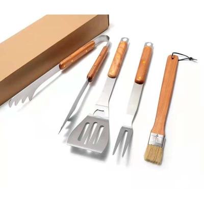 China Amazon Hot Selling Sustainable Stainless Steel Food Camping Tongs With Wooden Handle for sale