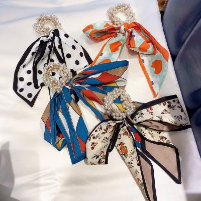 China New Trendy Floral Bow Hair Scrunchies Ponytail Holder Fashion Scrunchies with Beads Bow Scrunchies Scarf for sale