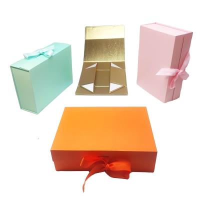 China Handmade Wholesale Custom Gold Magnetic Foldable Paper Box Box For Handbag And Packaging Garment for sale