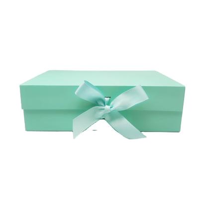 China Handmade Hot Selling Elegant Blue Paper Folding Gift Box with Magnetic Closure and Silk Ribbon for Packaging Chocolate and Flowers for sale