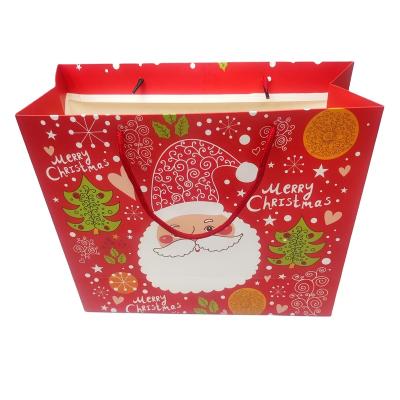 China Custom Recyclable Paper Sack Gift Bag Christmas Bag With Different Colors, Designs And Ribbon Handle for sale