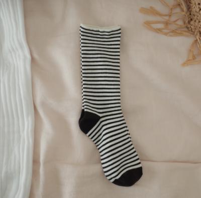 China Unisex Casual Daily Basic Breathable Striped Socks Black White Stripe Pattern Crew Socks for sale