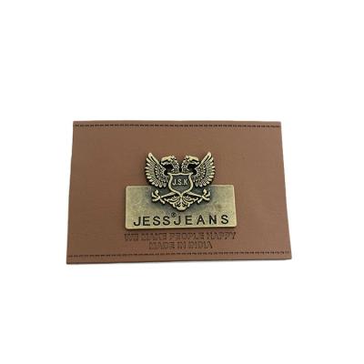 China Sustainable Custom Leather Label With Engrave Logo Metal Plate For Jeans for sale