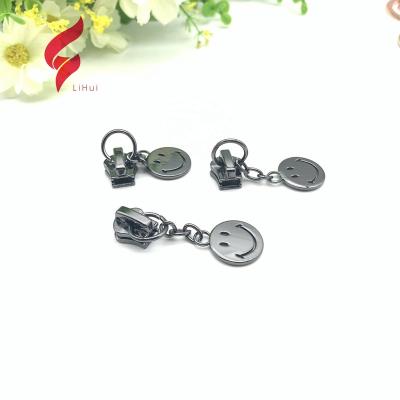 China Fashion metal design puller fancy embossed logo nickel free best selling brand embossed zipper pulls wholesale for sale