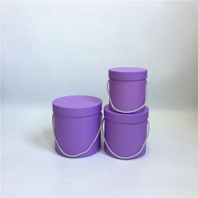 China Recyclable Green And Purple 3 Pcs Set Round Flower Box With Handle for sale