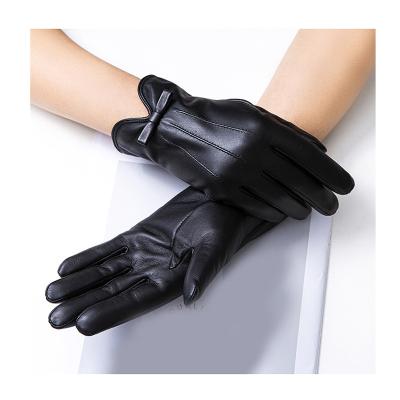 China Solid Leather Luxury Women Branded Bow Leather Sheepskin Gloves Travel Outdoor Cycling Motor Increasing Ladies Full Finger Touch Screen Gloves for sale