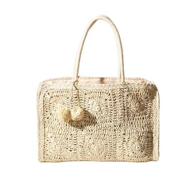 China Newest Designer Hallow Straw Women Hand Bags Simple Fashion Style Straw Big Bucket Tote Bag Cute Pom Pom Travel Beach Decoration for sale