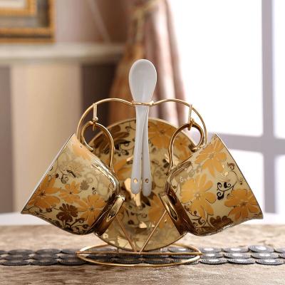 China Luxury Modern Golden Stocked Decal Design 2 Person Used Coffee Mug Set Ceramic Cup Saucer Set With Iron Stand for sale