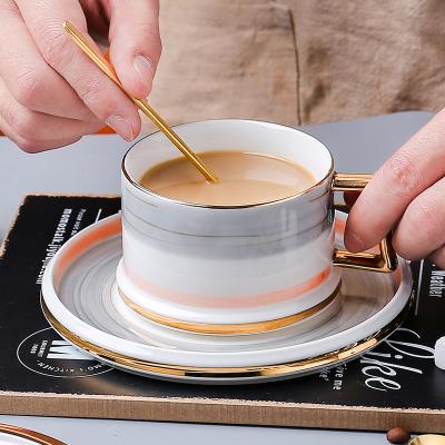 China Gold Hand Painted Stocked Rim Home Decor Ceramic Coffee Cup Handle Nordic Style Cup And Saucer Set For Coffee for sale