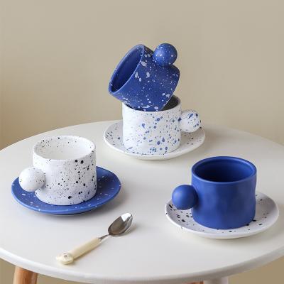 China Unique Stocked Porcelain Coffee Cup Set Dessert Dish Handle Ink Dot Design Ceramic Cup With Saucer for sale