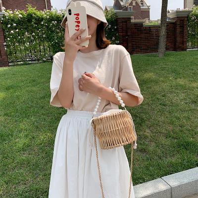 China Hot Selling Fashion Beach Fashion Pearl Bucket Bag Rattan Portable Clutch Bag for sale