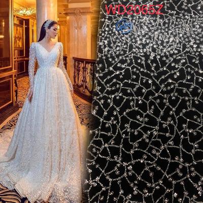 China Crystal Sequins Heavy Beaded Fabric Bridal White Lace Wedding Dress for sale