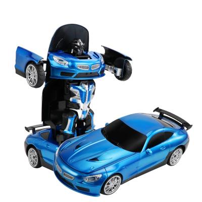 China 1:12 2.4G Remote Control Cool Rc Deformation Robot Sports Car Children's Remote Control Sensing Gesture Toy Deform Car Toy for sale