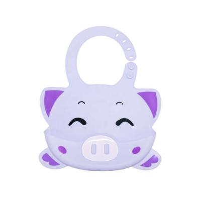 China Cartoon Latex Free Silicone Baby Bib Pig Pin Waterproof Pouch for sale