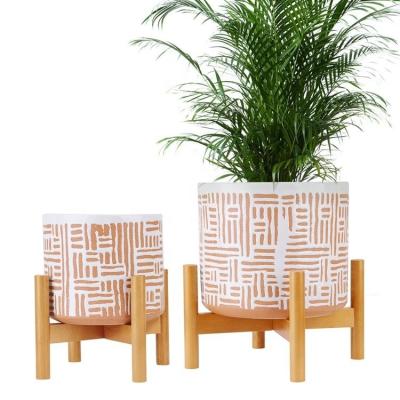 China Modern Hot Sale Home Decoration Planter Indoor Ceramic Flower Pot With Wooden Stand Set Of 2 for sale