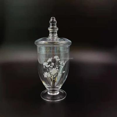 China Clear Eco-friendly Recyclable Antique With White Flower Glass Candy Snack Jar With Unique Lid Bottom for sale