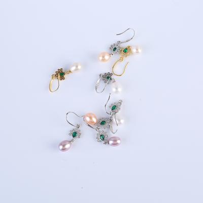 China Wholesale Fashionable and Beautiful Fashionable and Beautiful Silver Plated Natural Freshwater Pearl Ellipse Butterfly Earrings for sale