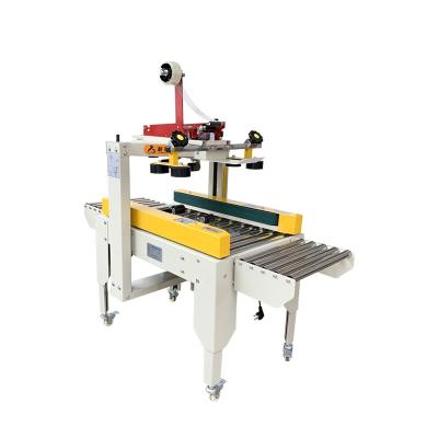 China 220V/50HZ Semi-Automatic Adhesive Tape Carton Box Left And Right Drive Sealing Packing Machine for sale