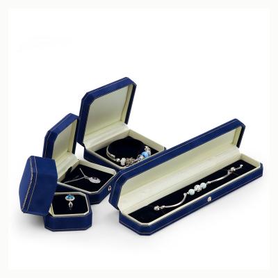 China Jewelry Packaging Jewelry Box Dark Blue Octagonal Diamond Velvet Luxury Ring Box Inside Cream Jewelry Packaging Box for sale