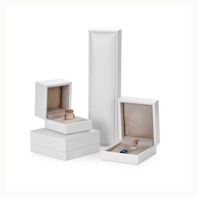 China Jewelry Packaging Luxury Jewelry Packaging Boxes PU Ring Necklace Box Cream Suede White Interior for sale