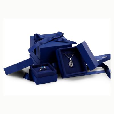 China Jewelry Packaging Wholesale Customize Ring Earring Box Navy Blue Cardboard Luxury Paper Jewelry Box With Ribbon for sale