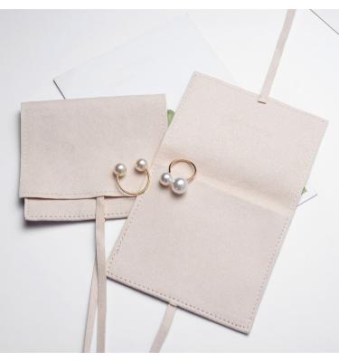 China Jewelry Packaging Customize Suede Envelope Jewelry Pouch With Flap For Jewelry Box for sale