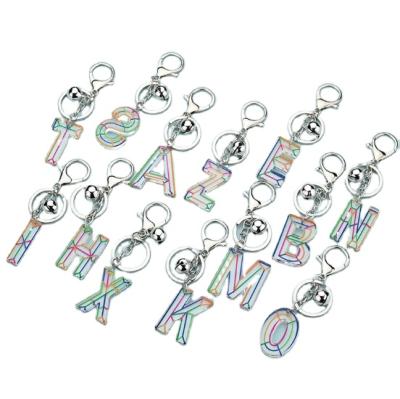 China Promotion Gift Fashion Acrylic Metal Tassel Alphabet Letter Hair Ball Charm Dangle Key Chain for sale