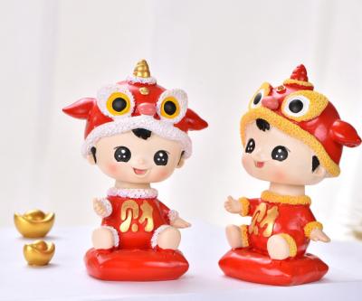 China Resin /plastic hotsale to buy for 2021 chinese new year baby boy girl red color car home shake head for sale