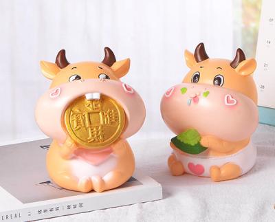 China Creative Resin /plastic Gifts Home Event Decoration Cow Piggy Bank Decor For Chinese New Year for sale