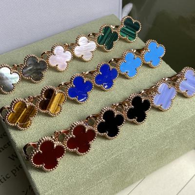 China Trend New High Quality Alloy Lucky Clover Earrings Shape Van Clover Classic Natural Fritillaria Clip Flower Micro Label Earrings for sale