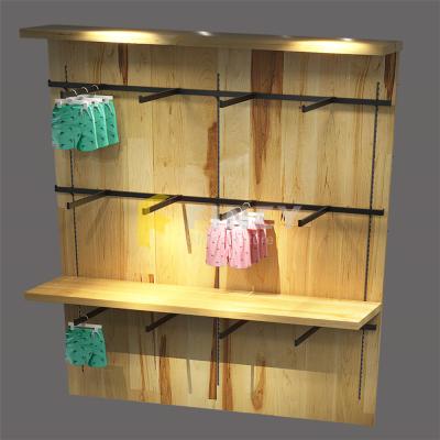 China Interior design decoration wooden store display wooden store swimwear shelves table counter racks for swimwear display for sale