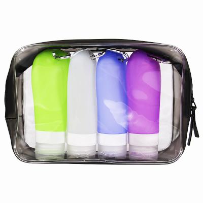 China Refill Lotion Straining Product 2022 Silicone Reusable Travel Kits Mini 4 in 1 Portable Lotion Bottle Refillable Travel Set with Key Chain for sale